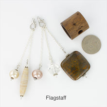 Load image into Gallery viewer, Flagstaff scarf slide components laying next to a quarter iBella® Scarf Slides and scarf slide sets, jewelry sets.