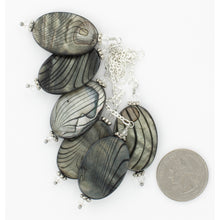 Load image into Gallery viewer, A view of multiples of the gray pendants showing the patterns vary. iBella® Scarf Slides and scarf slide sets, jewelry sets.