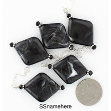 Load image into Gallery viewer, A view of the black pendant showing variations in the stone. iBella® Scarf Slides and scarf slide sets, jewelry sets.