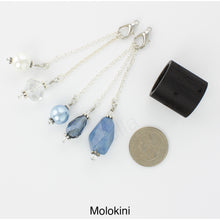 Load image into Gallery viewer, Photo of Molokini scarf slide set with interchangeable beads showing all 5 beads that comes with the scarf slide set and showing a quarter to understand the size of the scarf slide beads. iBella® Scarf Slides and scarf slide sets, jewelry sets.