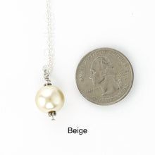 Load image into Gallery viewer, Scarf slide jewelry set extra pearl titled Beige - view showing the pearl laying next to a quarter for size reference.