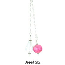 Load image into Gallery viewer, iBella® scarf slide jewelry set named Desert Sky - alternate view showing the scarf slide set beads of the pink pearl and the clear teardrop crystal. This scarf slide is pictured hanging. iBella® Scarf Slides and scarf slide sets, jewelry sets.