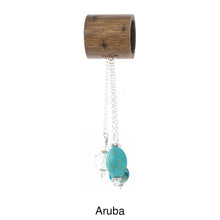 Load image into Gallery viewer, Scarf slide set titled Aruba - alternate view showing the turquoise pendant. This scarf slide is pictured hanging.