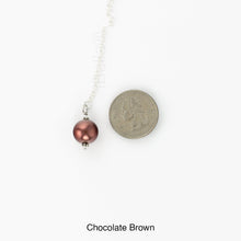 Load image into Gallery viewer, Scarf slide set extra glass pearl titled Chocolate - view showing the pearl laying next to a quarter for size reference.

