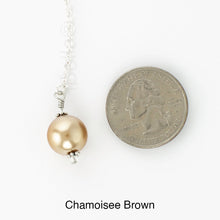 Load image into Gallery viewer, Scarf slide set extra glass pearl titled Chamoisee - view showing the pearl laying next to a quarter for size reference.
