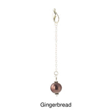 Load image into Gallery viewer, Scarf slide set extra glass pearl titled Gingerbread - view showing the pearl hanging.

