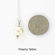Load image into Gallery viewer, Scarf slide jewelry set extra pearl titled Peachy Yellow - view showing the pearl laying next to a quarter for size reference.
