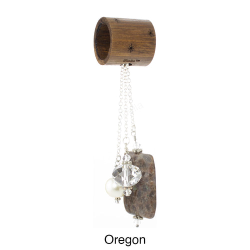 Scarf slide set titled Oregon - main view showing the brown pendant.  This scarf slide set has 5 beads.  The beads are a brown pendant, a blue pendant, a clear 16mm crystal, an antique white 12mm pearl and a blue 12mm pearl.  This scarf slide is pictured hanging.  iBella® Scarf Slides and scarf slide sets, jewelry sets.