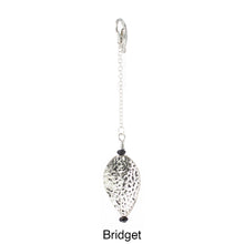 Load image into Gallery viewer, Scarf slide set extra pendant titled Bridget - view showing the silver pendant laying from a different angle.
